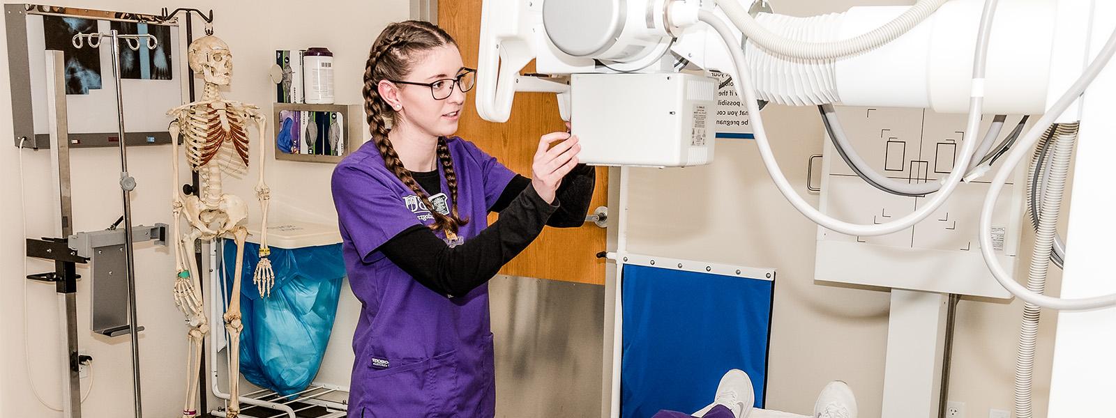 radiography student practices with MRI machine